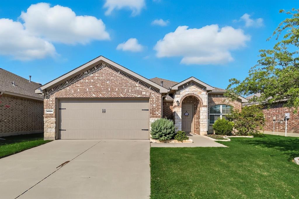 14564 Serrano Ridge Road Fort Worth, TX 76052 - Photo 2 of 29 a front view of a house with a yard and garage