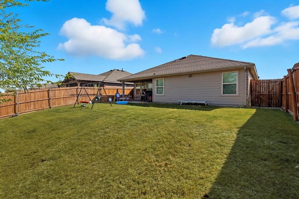 14564 Serrano Ridge Road Fort Worth, TX 76052 - Photo 23 of 29 a view of a house with a yard