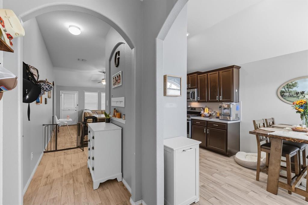14564 Serrano Ridge Road Fort Worth, TX 76052 - Photo 5 of 29 a kitchen with a refrigerator and a stove top oven