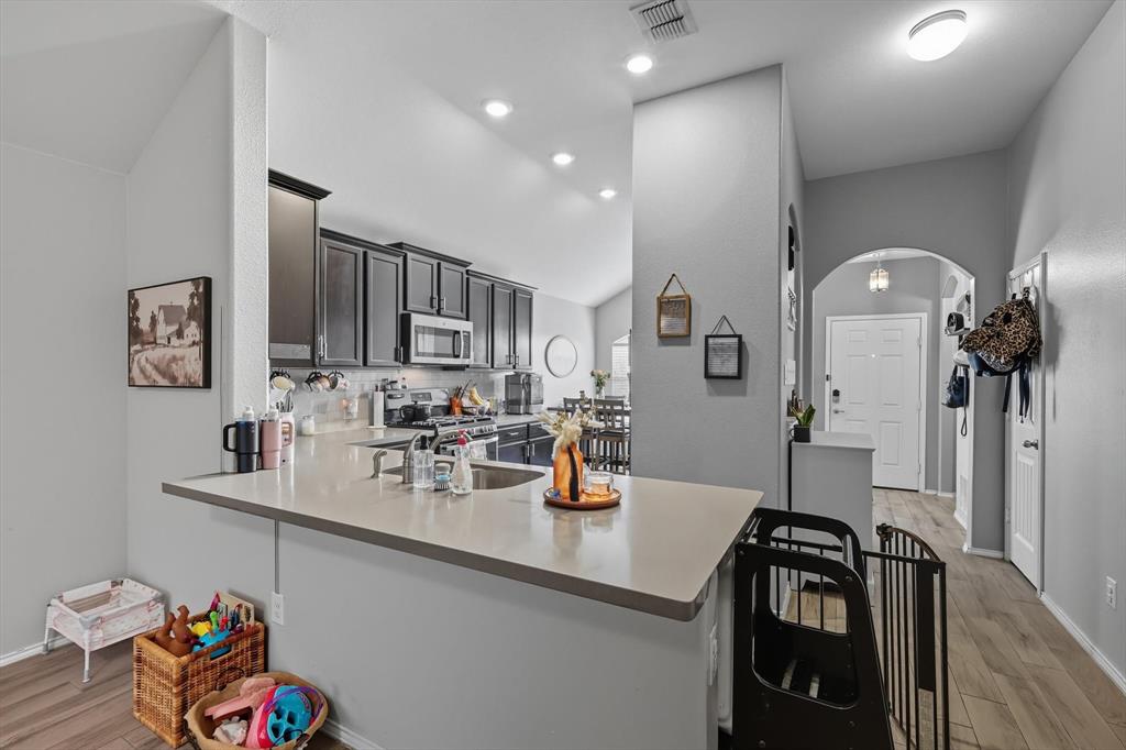 14564 Serrano Ridge Road Fort Worth, TX 76052 - Photo 10 of 29 a kitchen with a sink appliances and cabinets