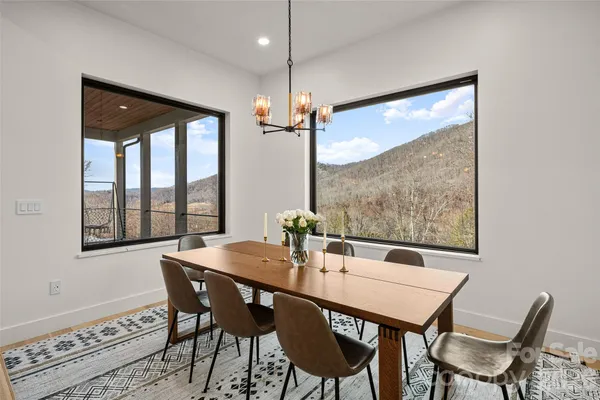 a dining room with furniture and window