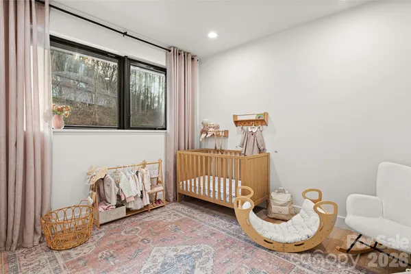 a bedroom with furniture and a window