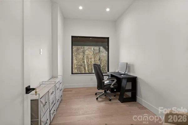a workspace with furniture and a window