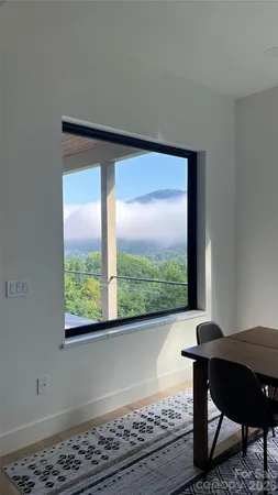 a living room with a table and chair