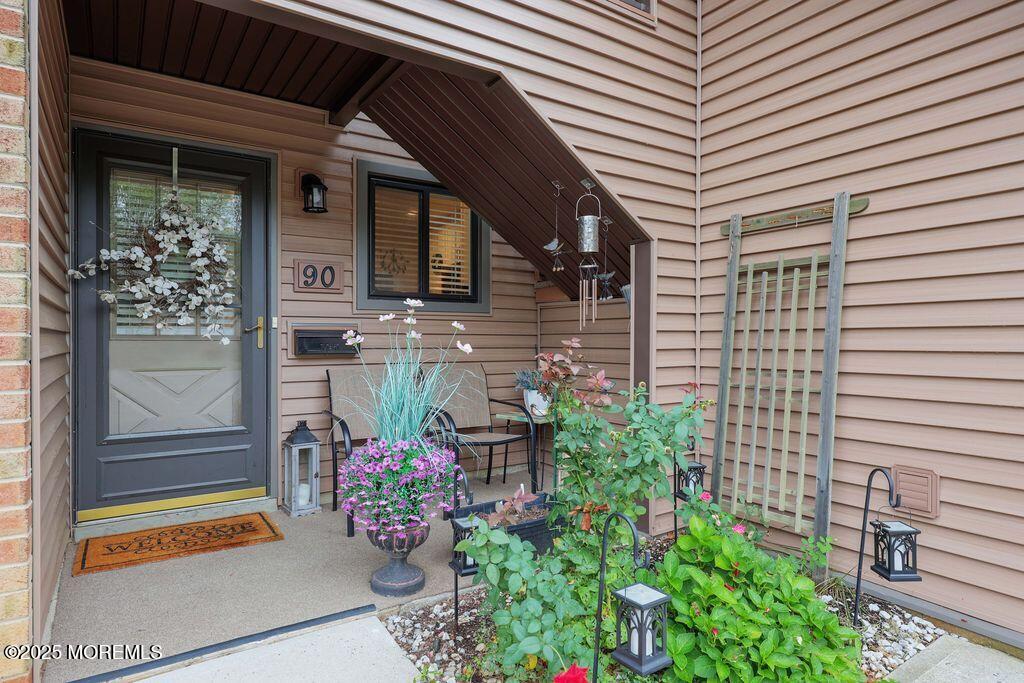 a front view of a house with outdoor seating