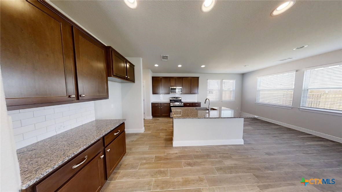 116 Hidden Branch Cove Maxwell, TX 78656 - Photo 4 of 23 a view of kitchen with granite countertop lots of counter top space