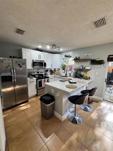 $353,000 | 7005 Northwest 173rd Drive, Unit 1702, Hialeah, FL 33015