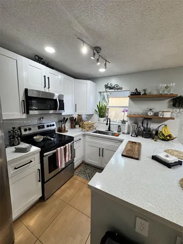 $353,000 | 7005 Northwest 173rd Drive, Unit 1702, Hialeah, FL 33015