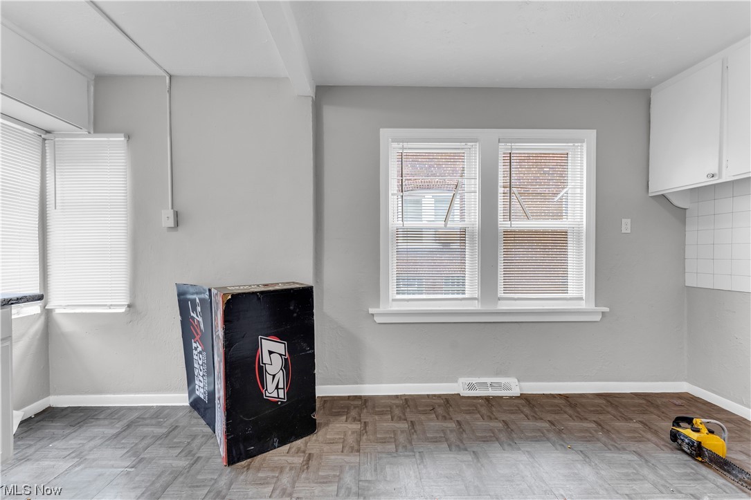 909 Stevenson Road Cleveland, OH 44110 - Photo 13 of 24 Living room featuring parquet flooring