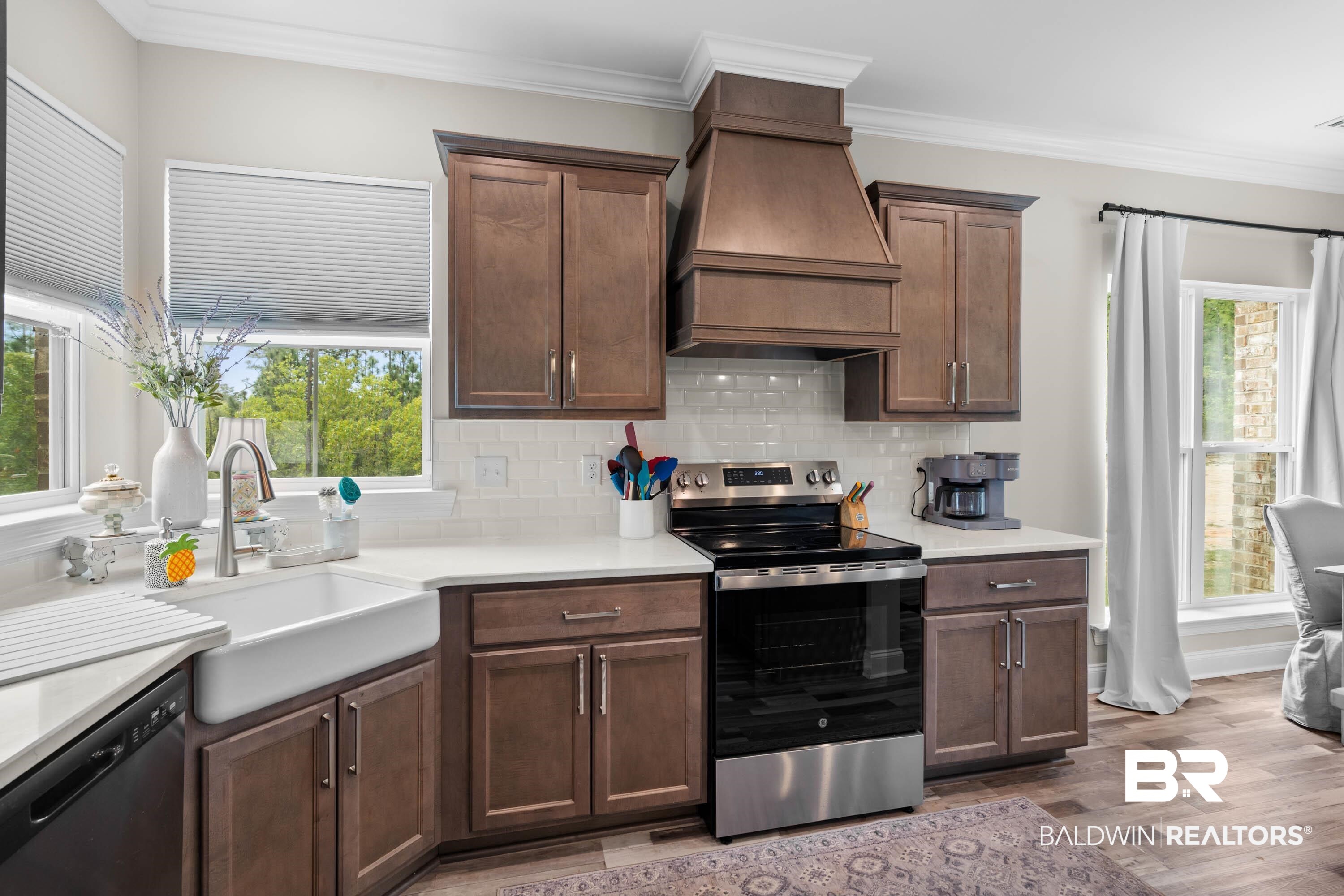 7150 Powell Road, Unit LOT 6A Eight Mile, AL 36613 - Photo 8 of 35 Kitchen with stainless steel range with electric stovetop, crown molding, dishwashing machine, tasteful backsplash, and dark wood-style flooring