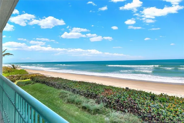 a view of an ocean and a city