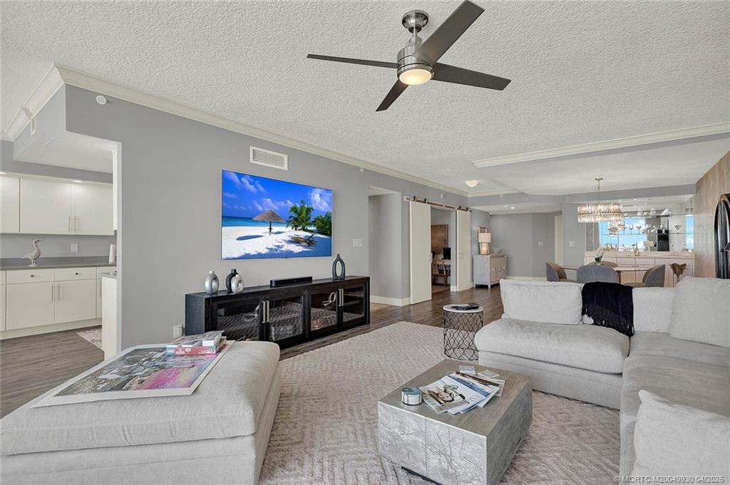 8600 South Ocean Drive, Unit LN3 Jensen Beach, FL 34957 - Photo 16 of 63 a living room with furniture and a flat screen tv