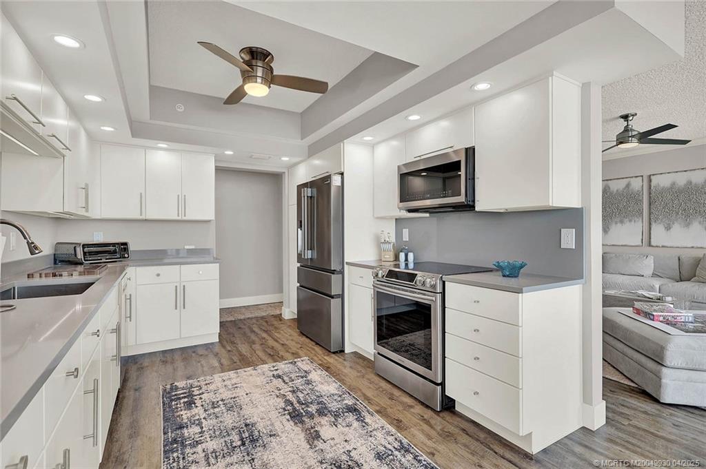 8600 South Ocean Drive, Unit LN3 Jensen Beach, FL 34957 - Photo 19 of 63 a kitchen with a stove microwave and cabinets
