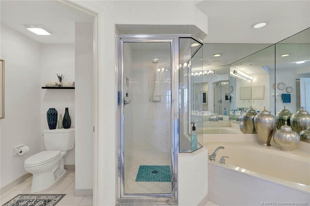 8600 South Ocean Drive, Unit LN3 Jensen Beach, FL 34957 - Photo 32 of 63 a bathroom with a bathtub shower sink and toilet