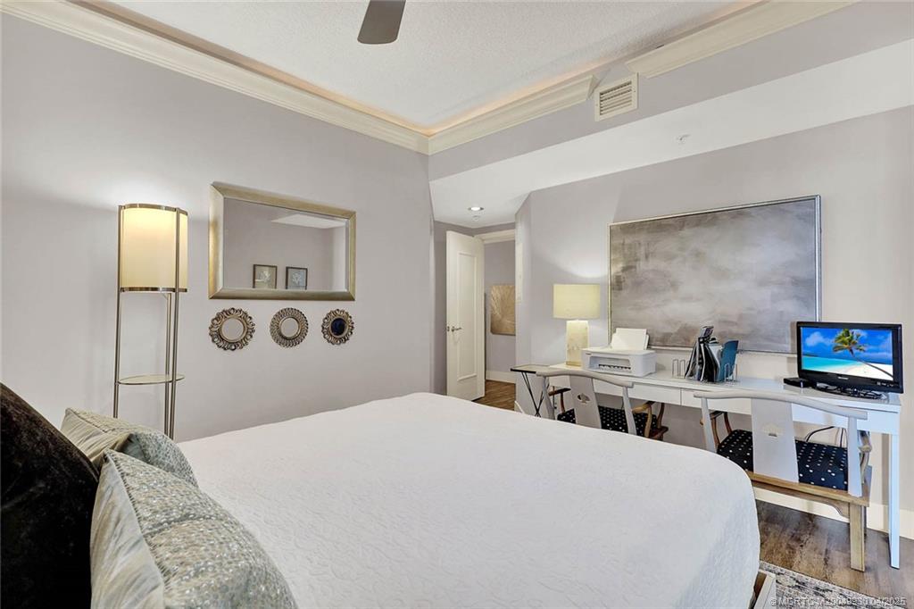 8600 South Ocean Drive, Unit LN3 Jensen Beach, FL 34957 - Photo 35 of 63 a bedroom with a bed and a flat screen tv