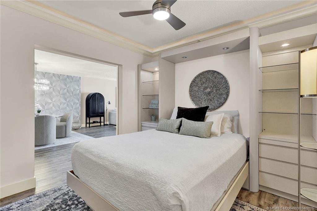 8600 South Ocean Drive, Unit LN3 Jensen Beach, FL 34957 - Photo 37 of 63 a bedroom with a bed a mirror and table lamp