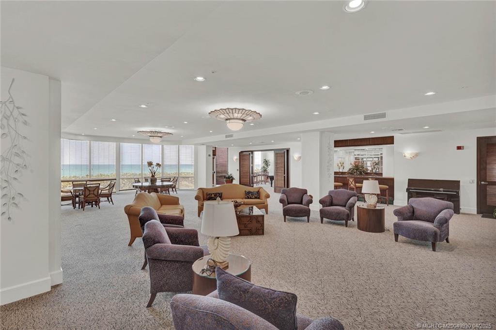 8600 South Ocean Drive, Unit LN3 Jensen Beach, FL 34957 - Photo 54 of 63 a living room with furniture white walls and white walls