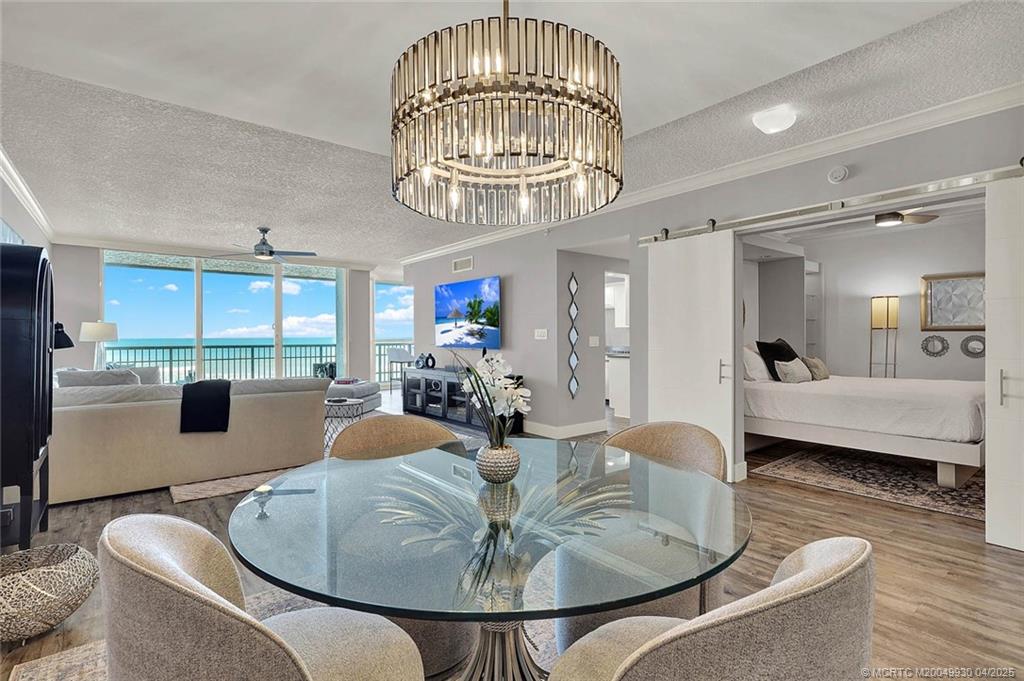 8600 South Ocean Drive, Unit LN3 Jensen Beach, FL 34957 - Photo 9 of 63 a living room with furniture a chandelier and a chandelier
