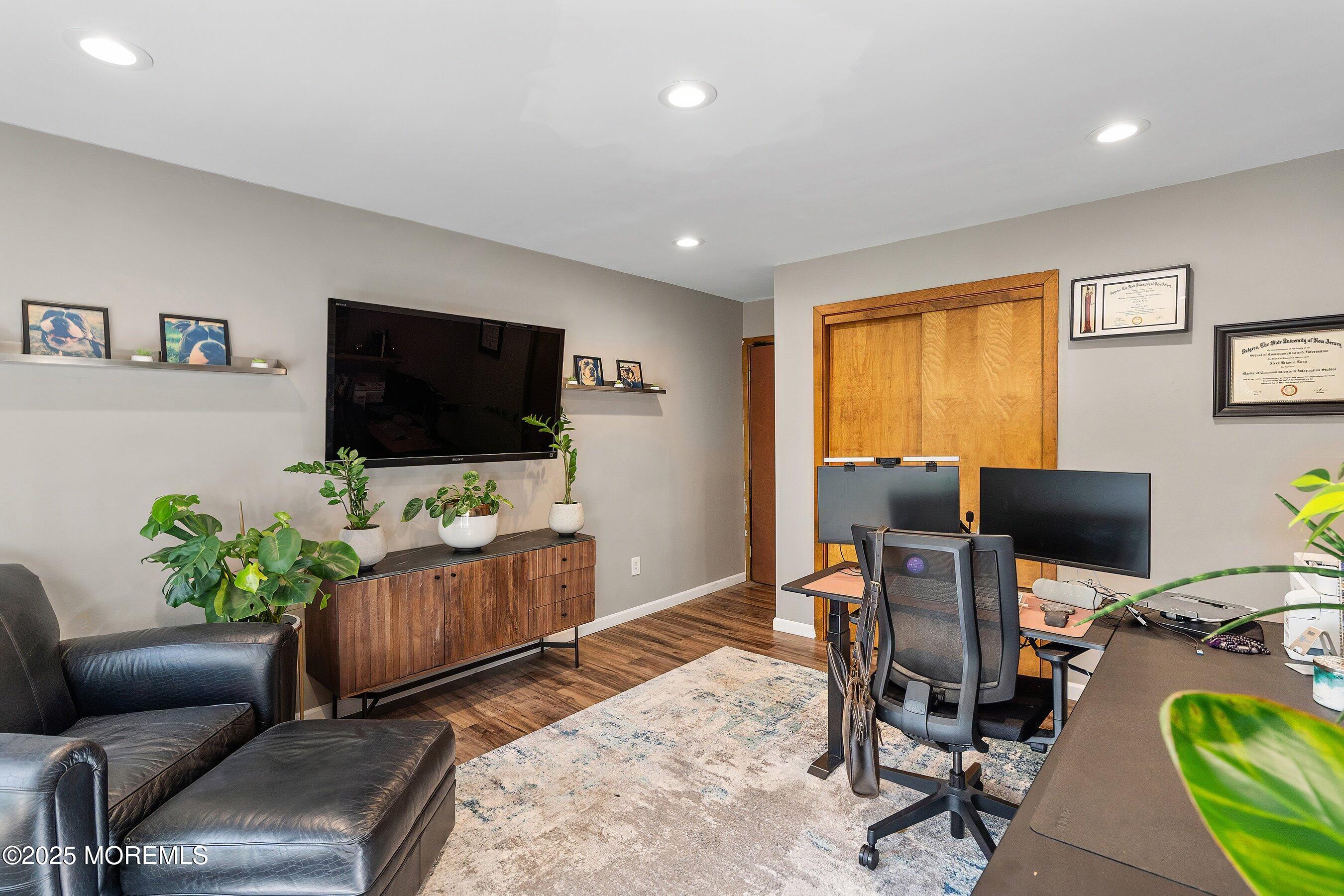 409 Aldrich Road Howell, NJ 07731 - Photo 13 of 27 a living room with furniture and a flat screen tv