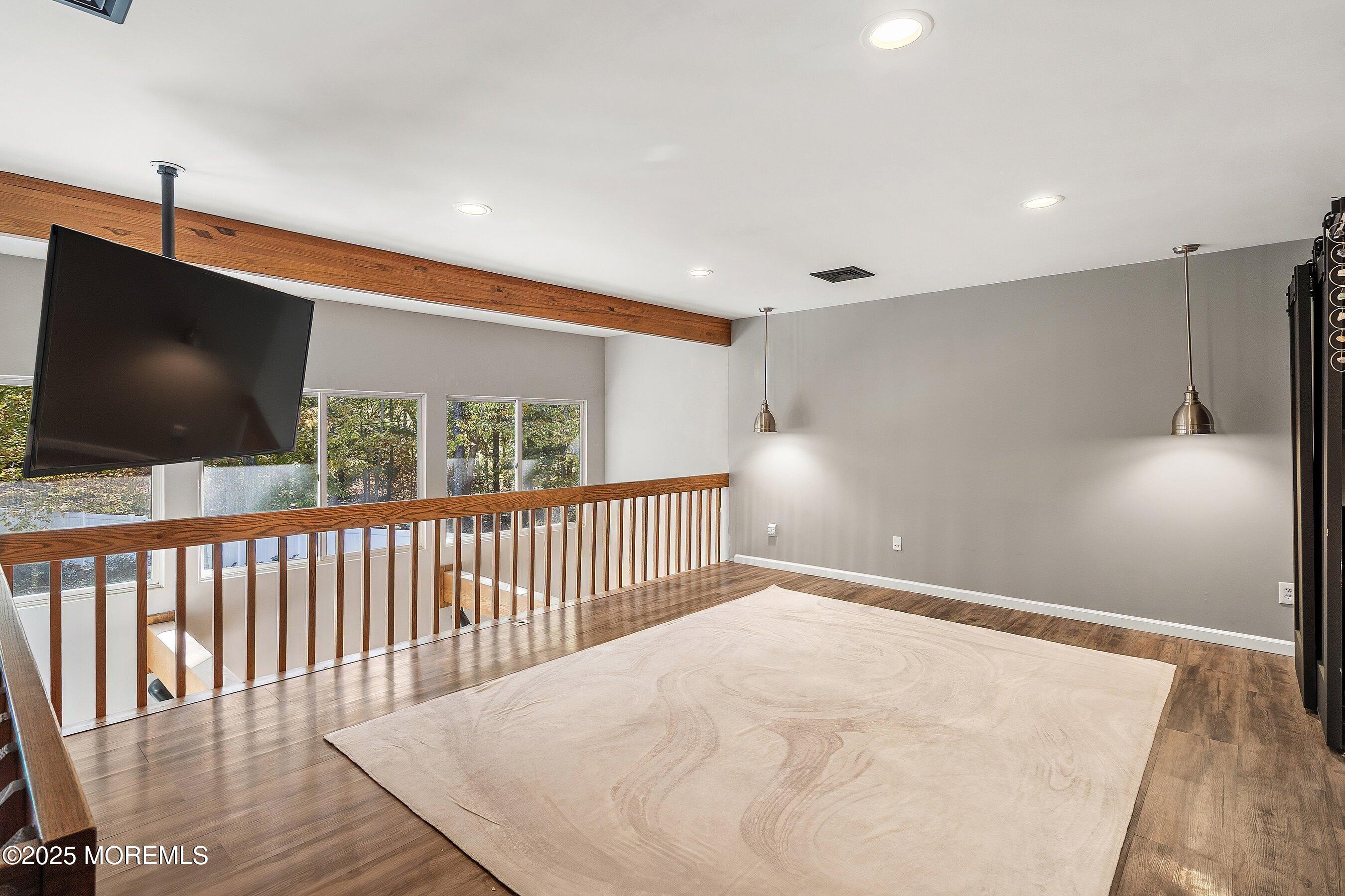 409 Aldrich Road Howell, NJ 07731 - Photo 18 of 27 a view of a living room and a flat screen tv