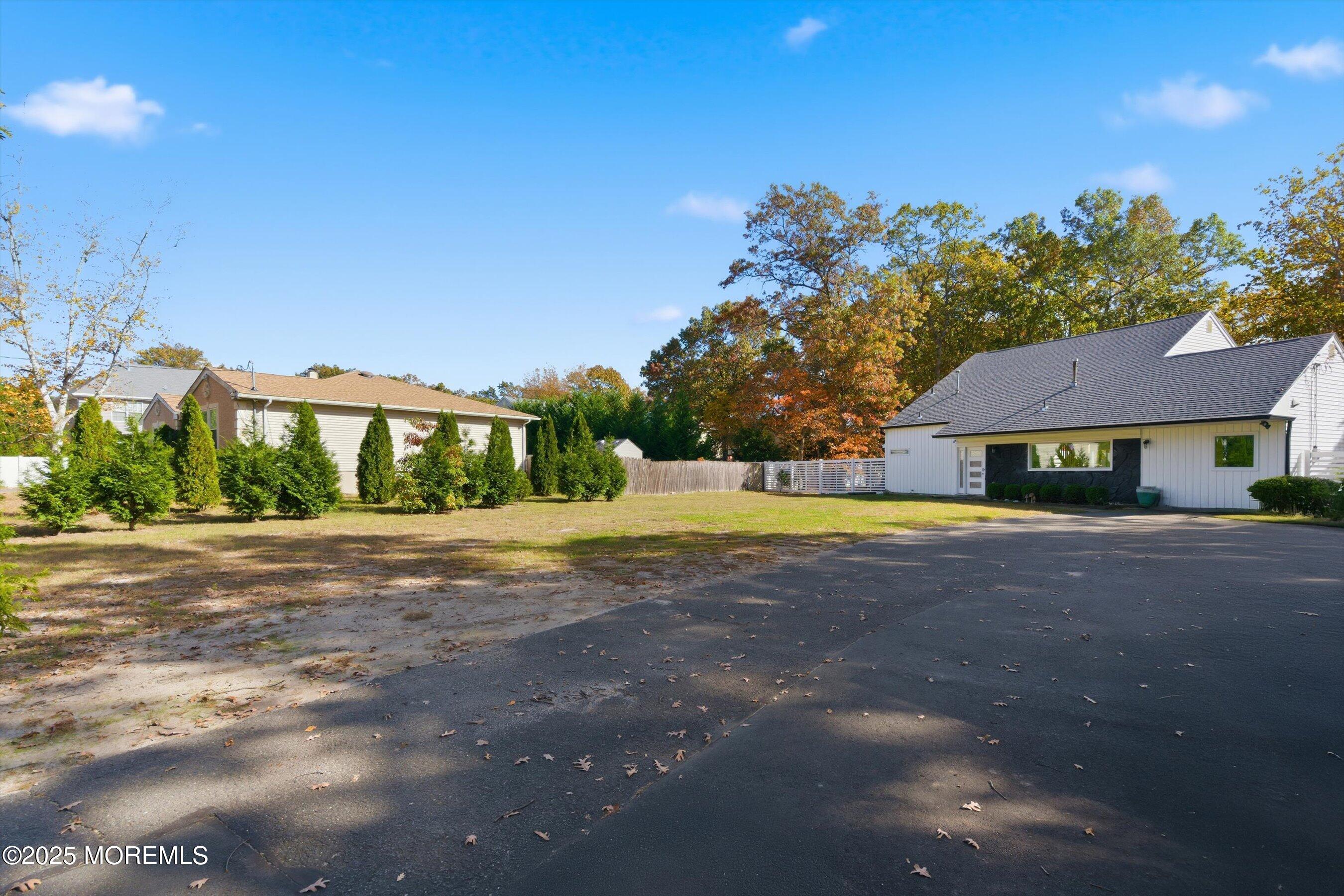 409 Aldrich Road Howell, NJ 07731 - Photo 2 of 27 a view of a house with a yard and basketball court