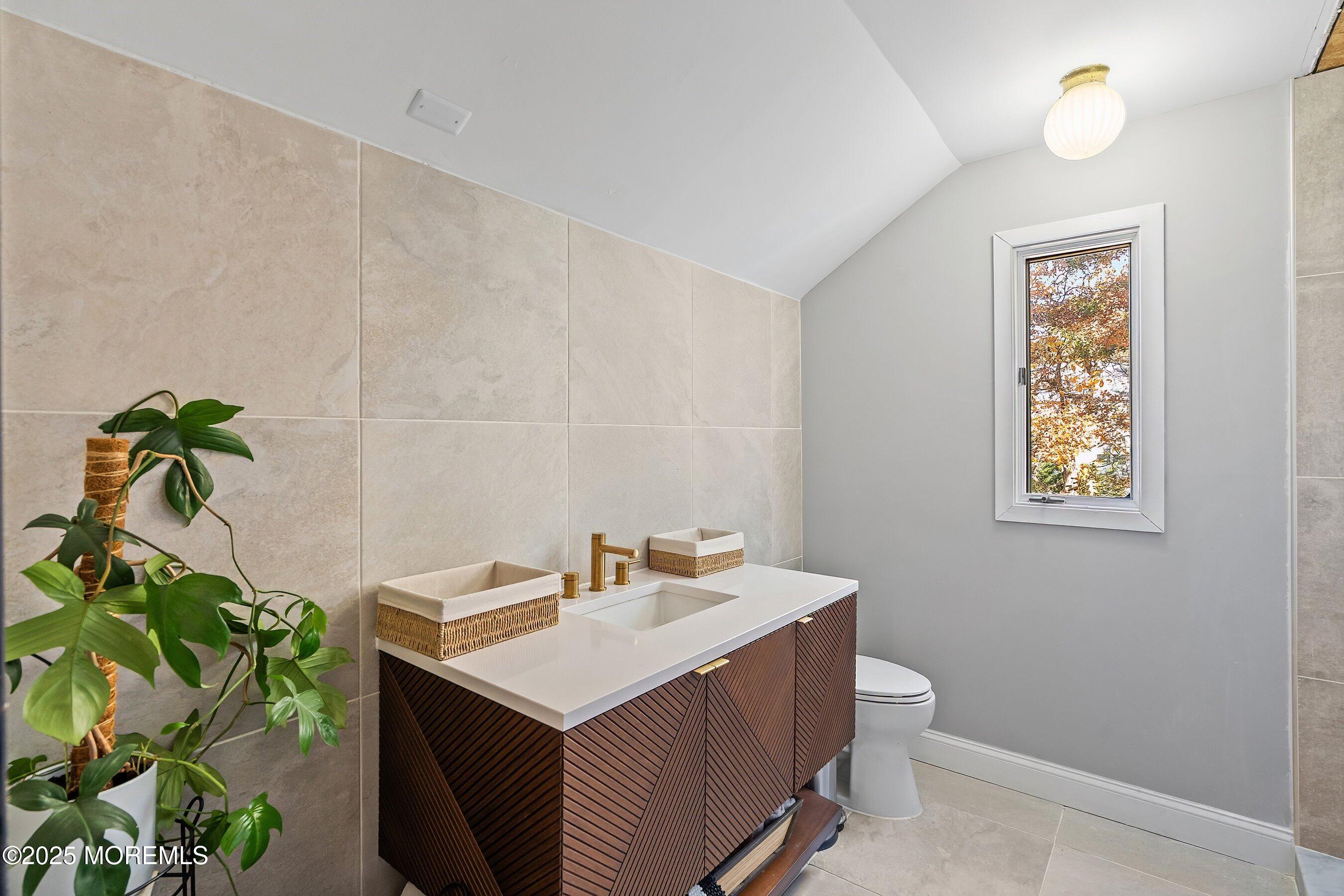 409 Aldrich Road Howell, NJ 07731 - Photo 21 of 27 a bathroom with a sink a toilet and with mirror