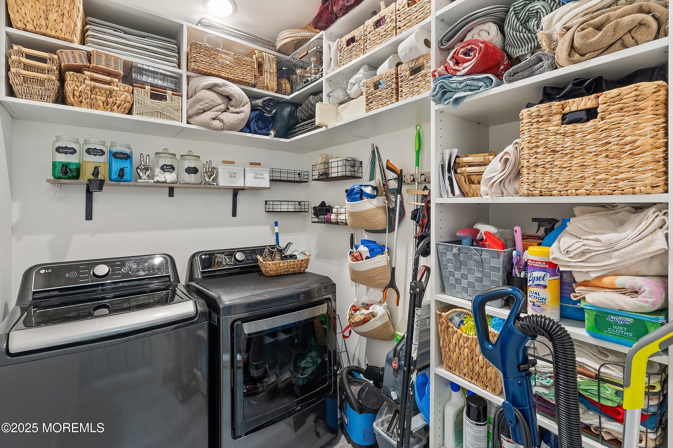 409 Aldrich Road Howell, NJ 07731 - Photo 22 of 27 a utility room with lots of clutter and cabinets