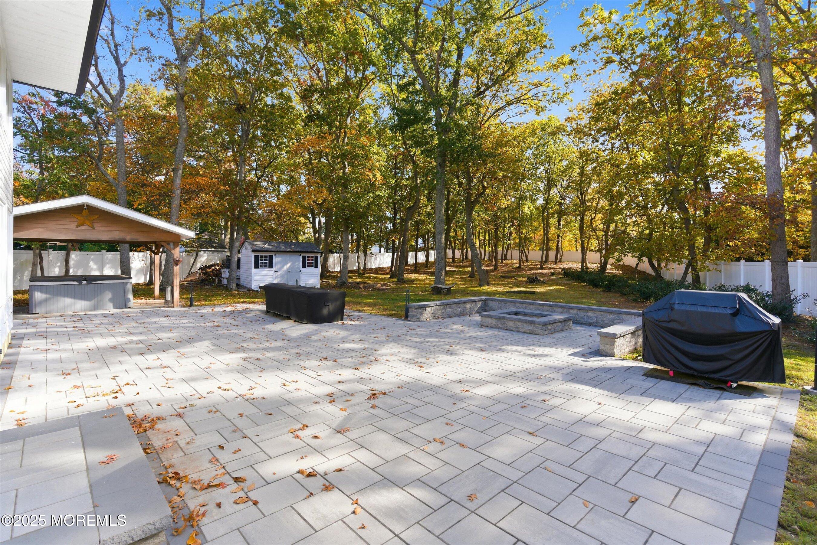 409 Aldrich Road Howell, NJ 07731 - Photo 23 of 27 a view of a table and chairs in backyard