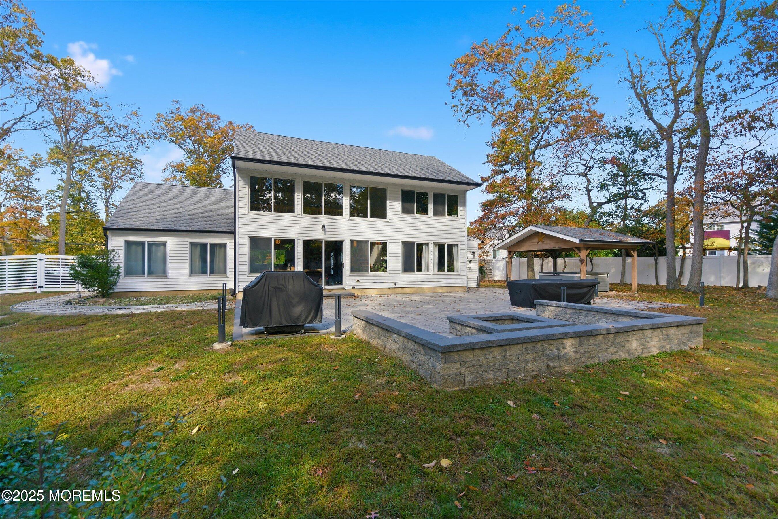 409 Aldrich Road Howell, NJ 07731 - Photo 24 of 27 a front view of a house with swimming pool having outdoor seating