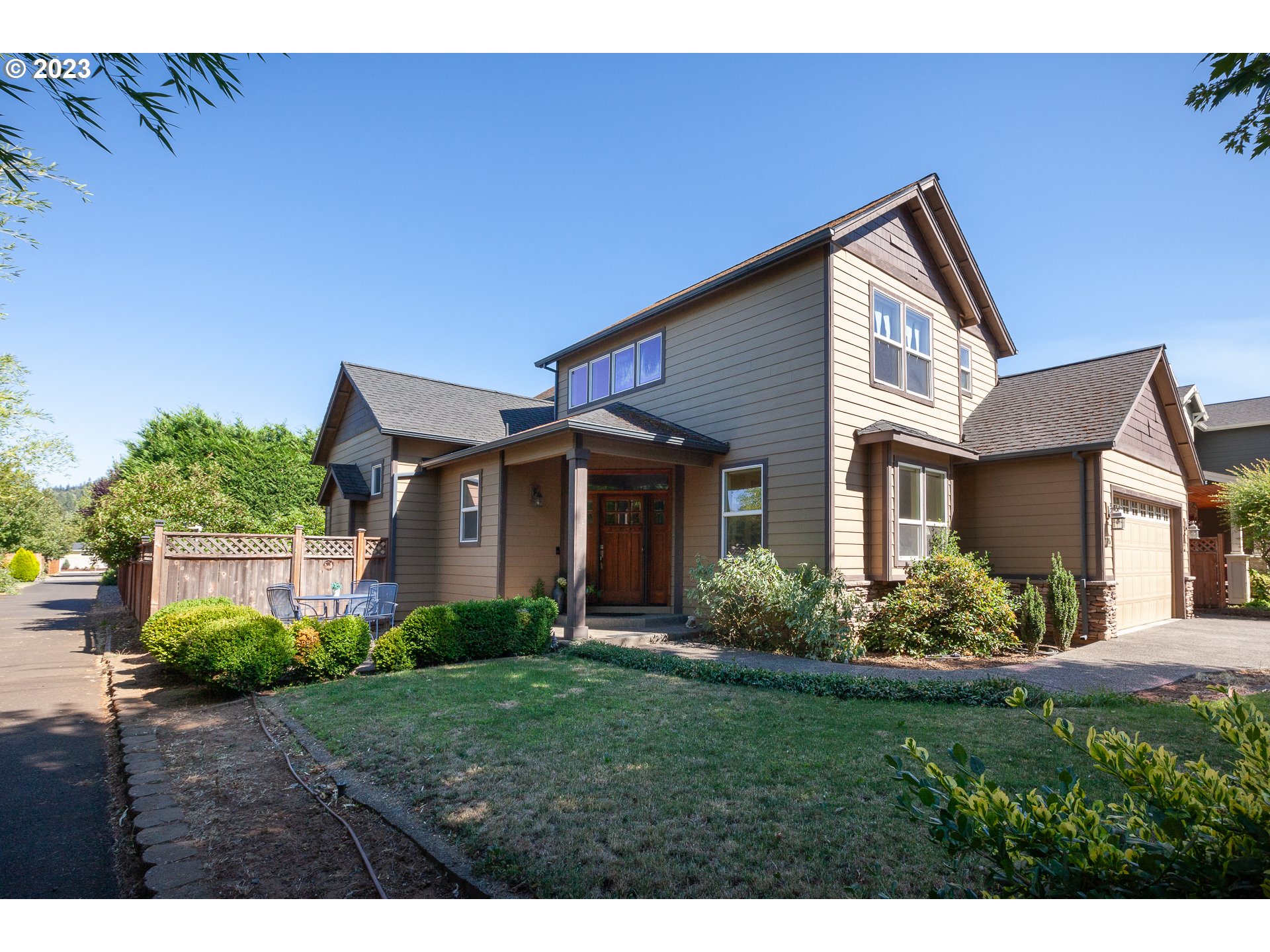 1615 4th Street Hood River, OR 97031 - Photo 1 of 33 a front view of a house with a garden