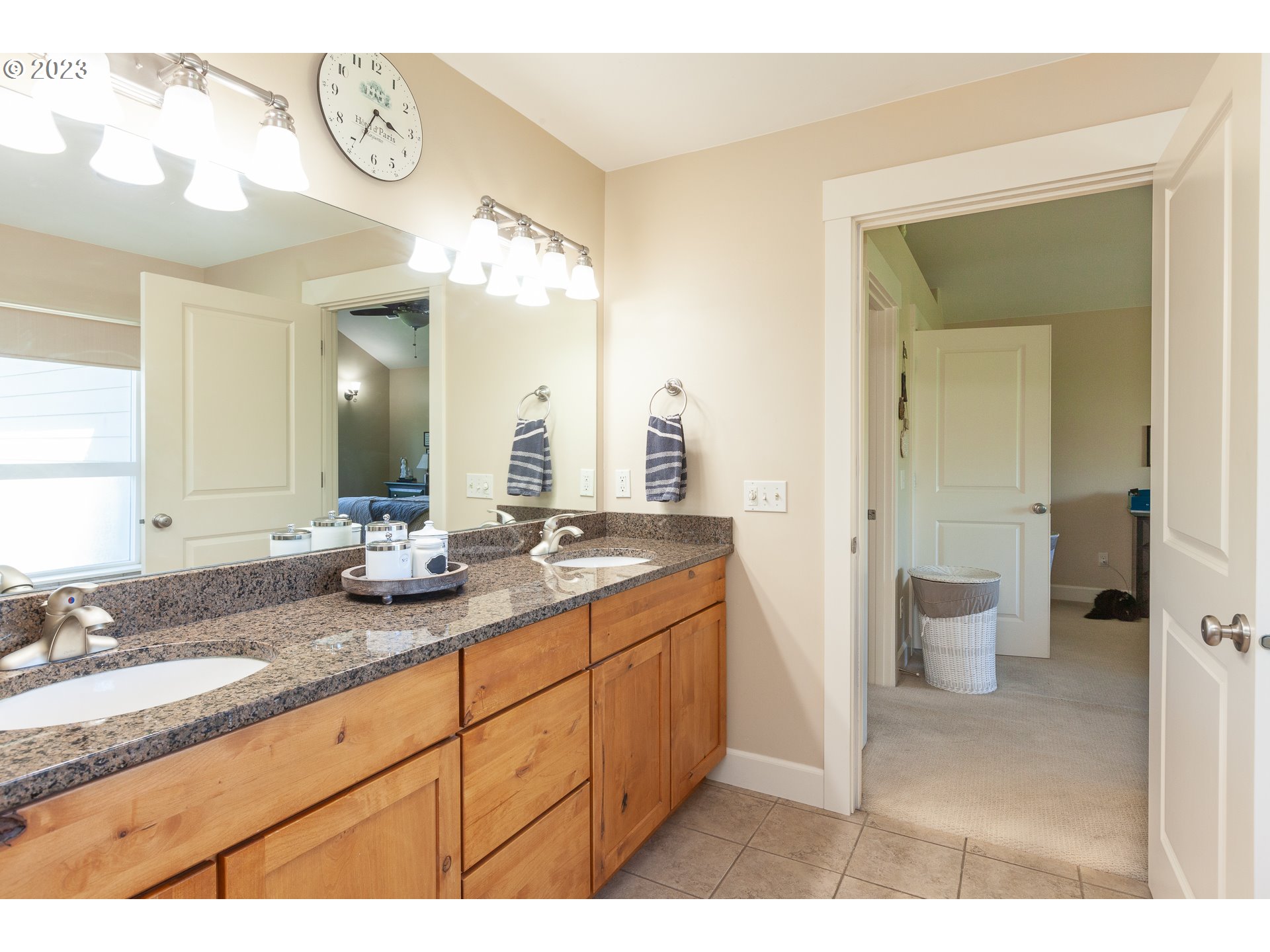 1615 4th Street Hood River, OR 97031 - Photo 21 of 33 a bathroom with a granite countertop sink and a mirror