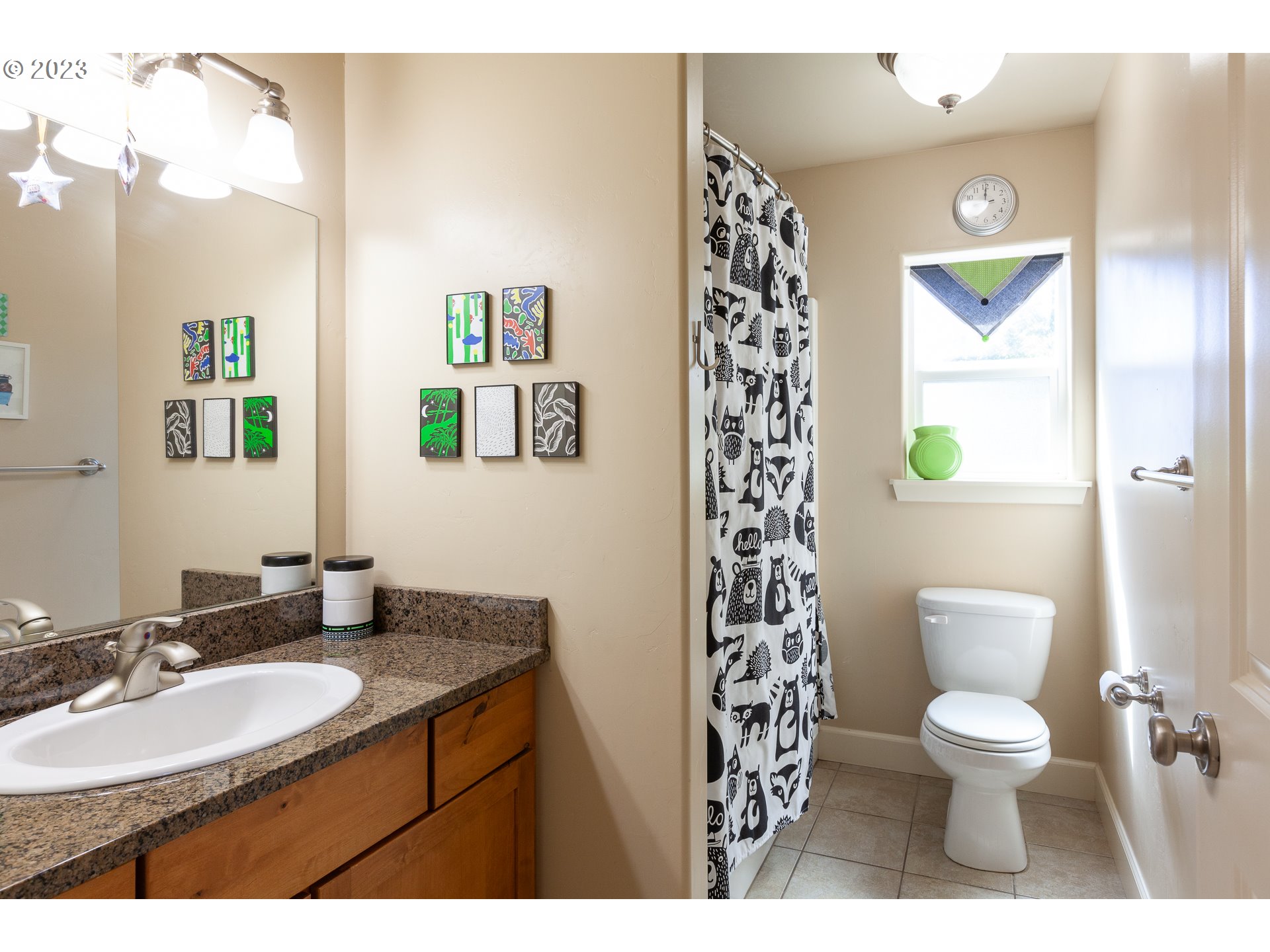 1615 4th Street Hood River, OR 97031 - Photo 25 of 33 a bathroom with a toilet a sink and a mirror