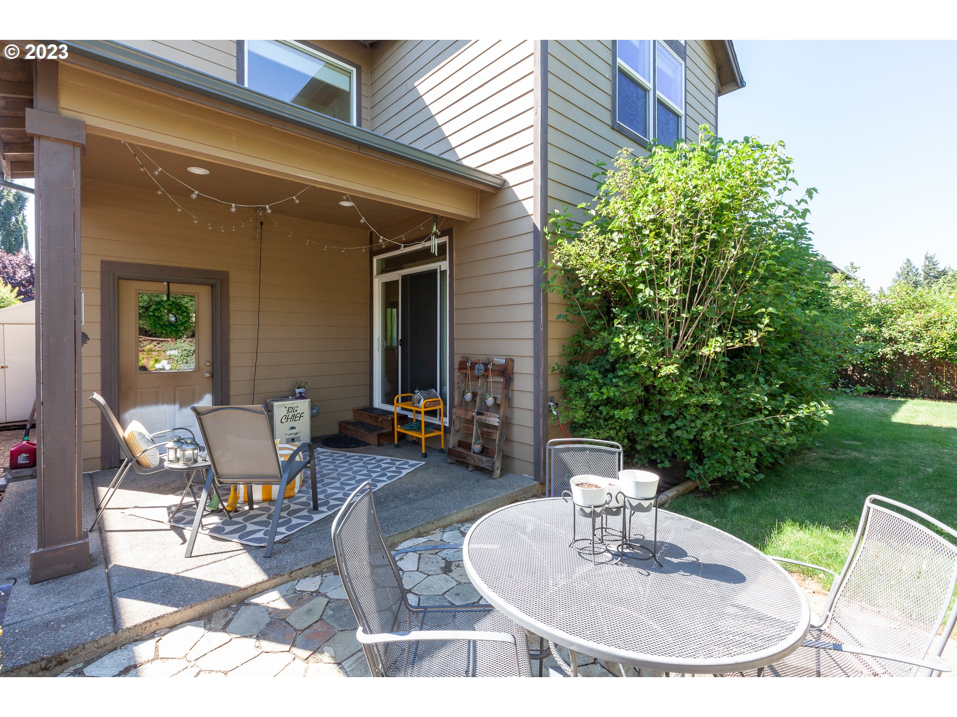 1615 4th Street Hood River, OR 97031 - Photo 27 of 33 a backyard of a house with outdoor seating