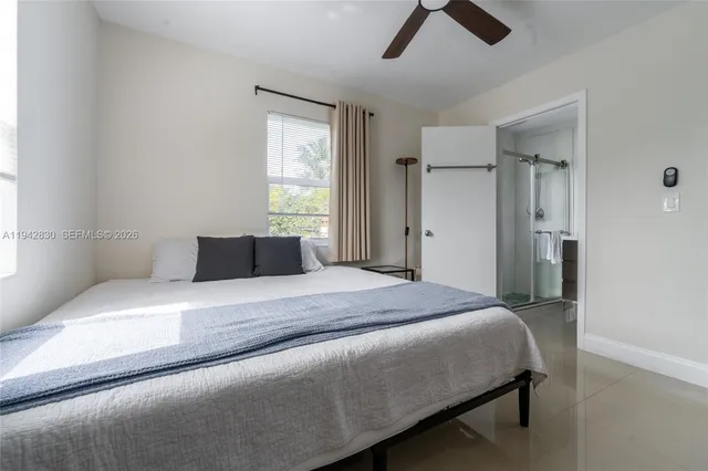 a bedroom with a bed and window