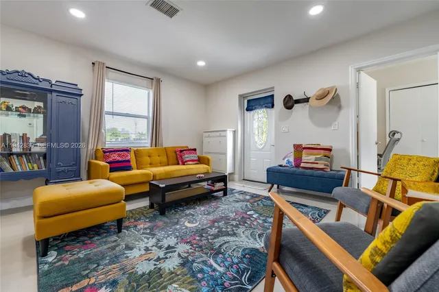 a living room with furniture and a window