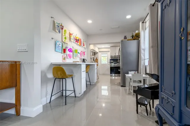 a room with furniture a rug and a flat screen tv