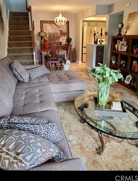 3110 Cochise Way, Unit 103 Fullerton, CA 92833 - Photo 2 of 14 a living room with furniture and a table