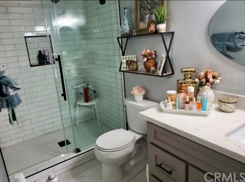 3110 Cochise Way, Unit 103 Fullerton, CA 92833 - Photo 6 of 14 a bathroom with a sink a toilet and shower