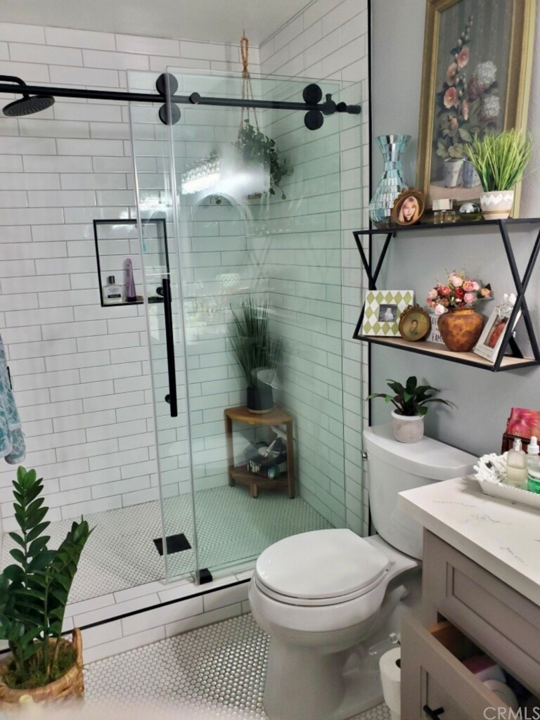 3110 Cochise Way, Unit 103 Fullerton, CA 92833 - Photo 7 of 14 a bathroom with a toilet and a shower