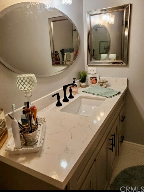 3110 Cochise Way, Unit 103 Fullerton, CA 92833 - Photo 8 of 14 a bathroom with a sink and a mirror