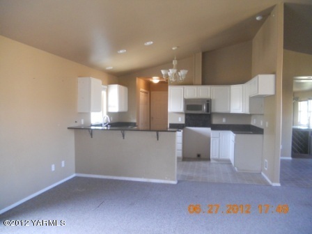 15721 Fisk Road Yakima, WA 98908 - Photo 3 of 9 a view of kitchen with kitchen island and stainless steel appliances