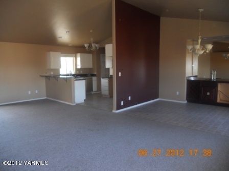 15721 Fisk Road Yakima, WA 98908 - Photo 4 of 9 a view of empty room with a kitchen