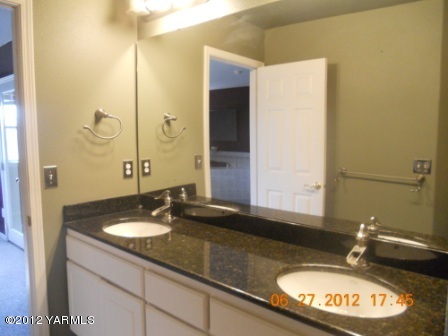 15721 Fisk Road Yakima, WA 98908 - Photo 7 of 9 a bathroom with a sink and a mirror