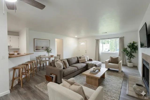 a living room with furniture and a large window