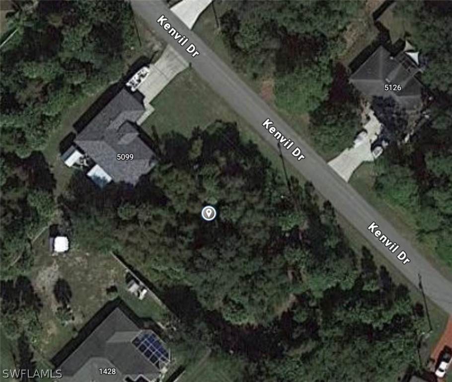 an aerial view of a house yard