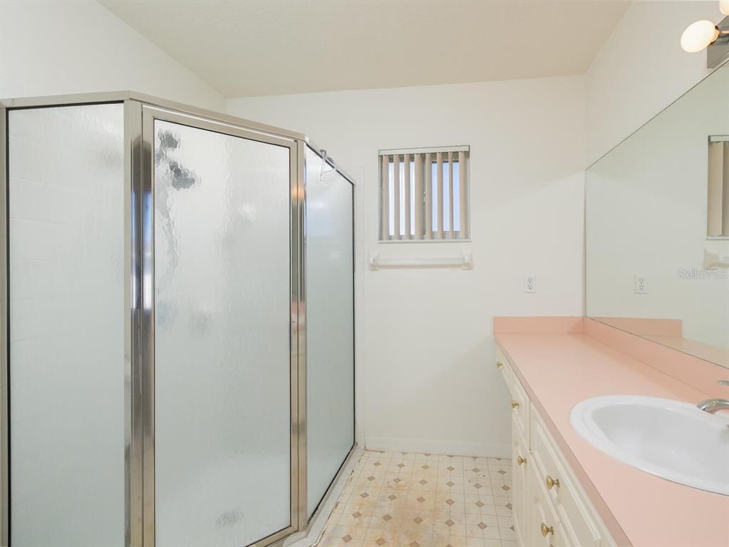 6086 Southwest 98th Loop Ocala, FL 34476 - Photo 14 of 49 a bathroom with a sink and a shower