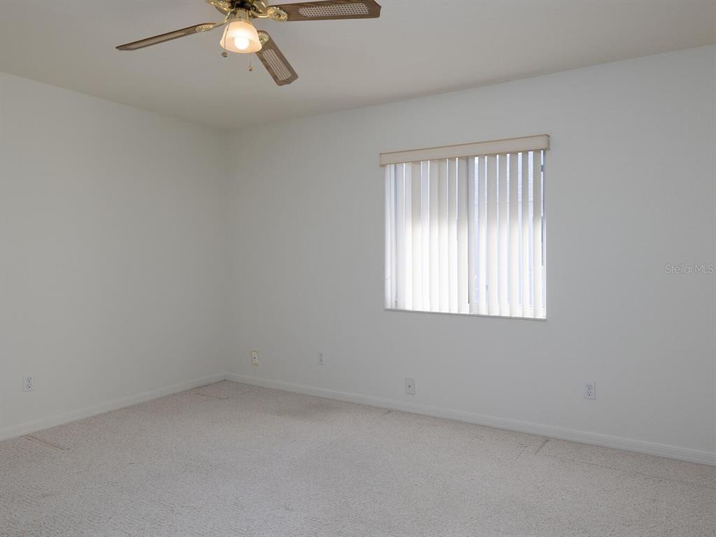 6086 Southwest 98th Loop Ocala, FL 34476 - Photo 16 of 49 an empty room with a window