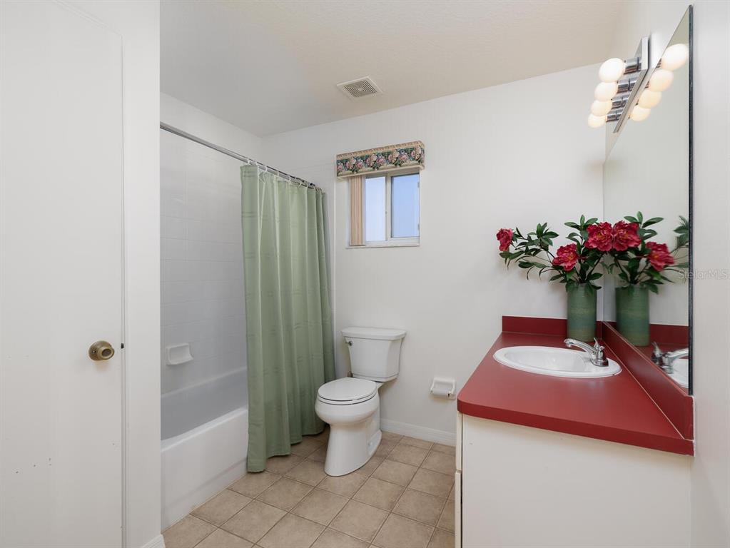 6086 Southwest 98th Loop Ocala, FL 34476 - Photo 18 of 49 a bathroom with a sink toilet and shower
