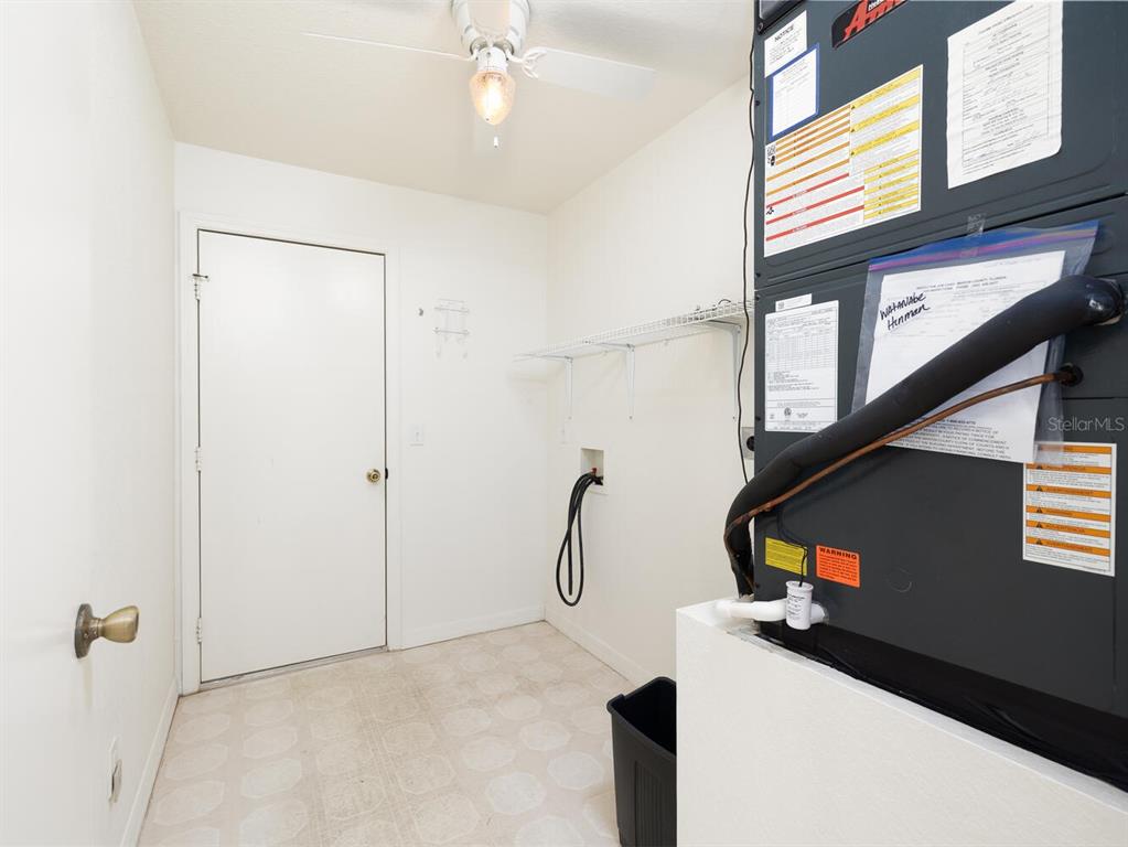6086 Southwest 98th Loop Ocala, FL 34476 - Photo 19 of 49 a picture of a room with wooden floor and windows