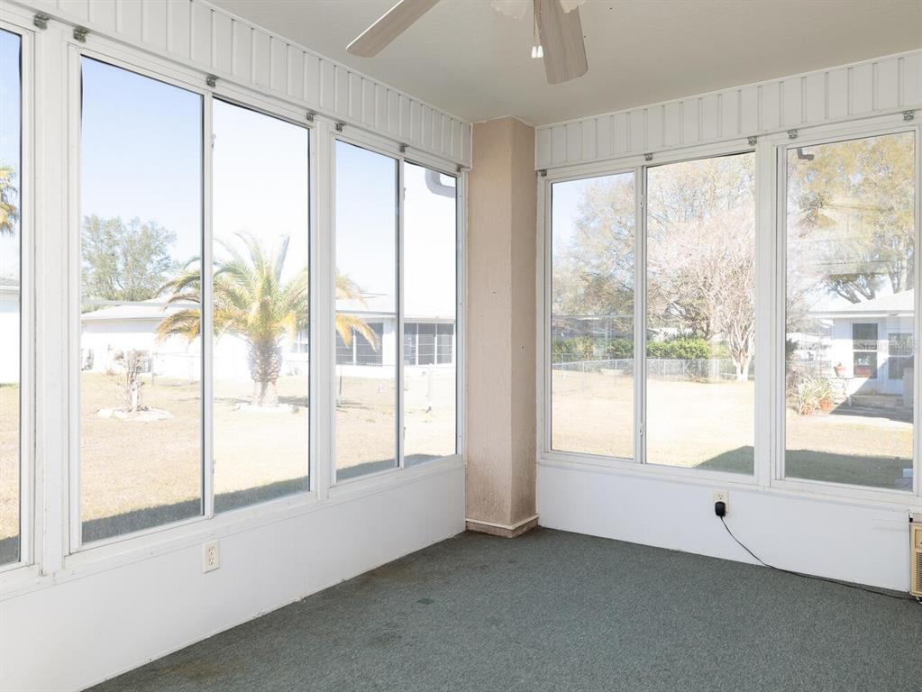 6086 Southwest 98th Loop Ocala, FL 34476 - Photo 21 of 49 a view of an empty room with large windows